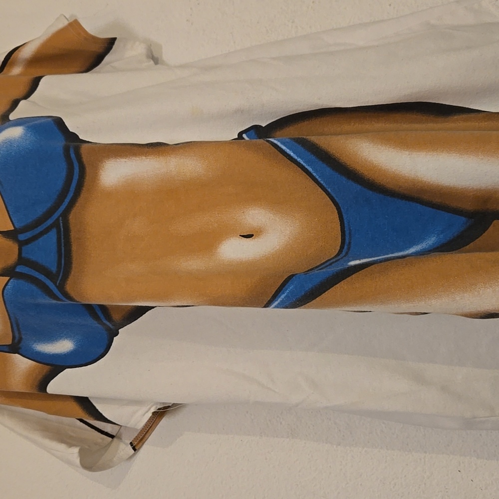 Vintage Graphic T-Shirt with Blue Tan Bikini Design On Front & Back Over Cover